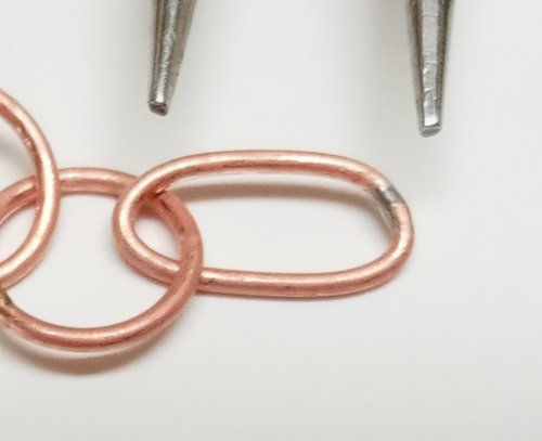 Judy Larson's Make a Soldered Paperclip Chain - , Contemporary Wire Jewelry, Making Chain, Chain Making , Coiling, Coiling Wire, Wire Coiling, Butane Torch, Soldering, Solder, Paste solder is very stiff so when stretching a link into an oval